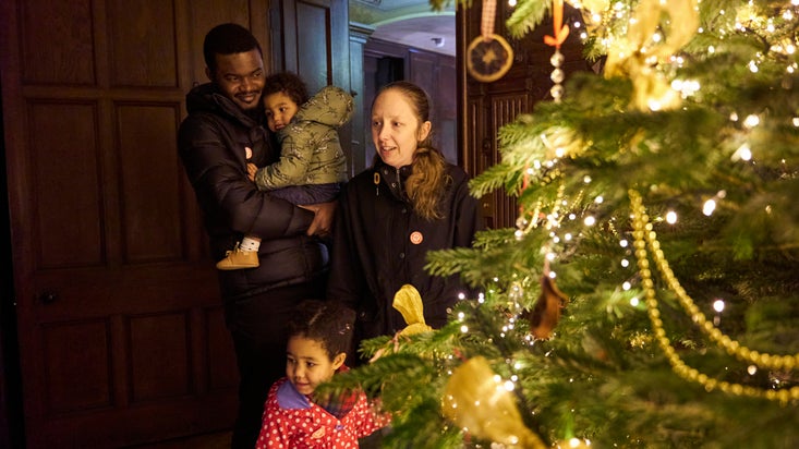 Family by the Christmas tree at Scotney Castle, Kent